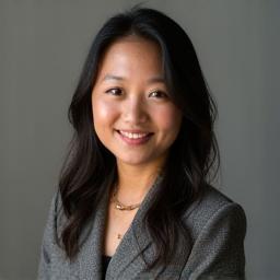 Headshot of Aisha, Narrative Designer.